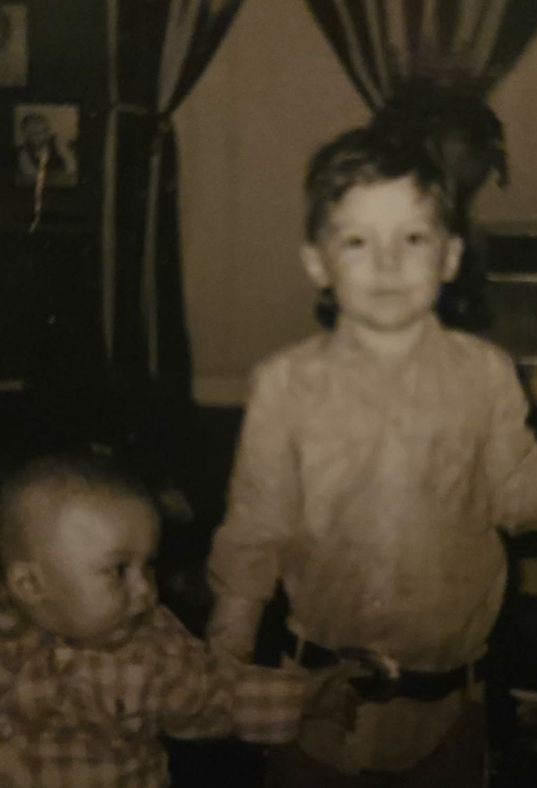 Black-and-white childhood photo of two young boys