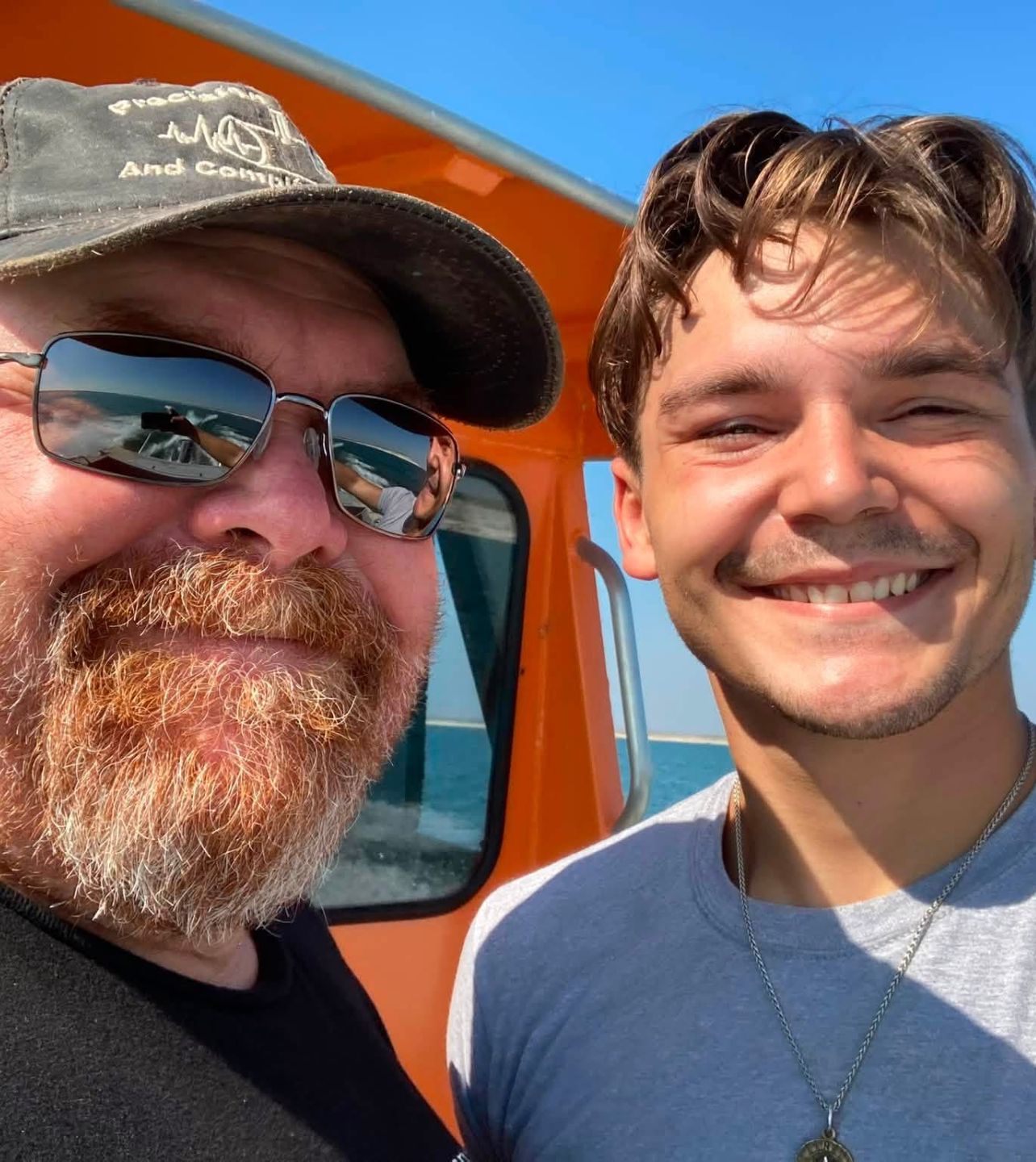 Neil in sunglasses with his son
