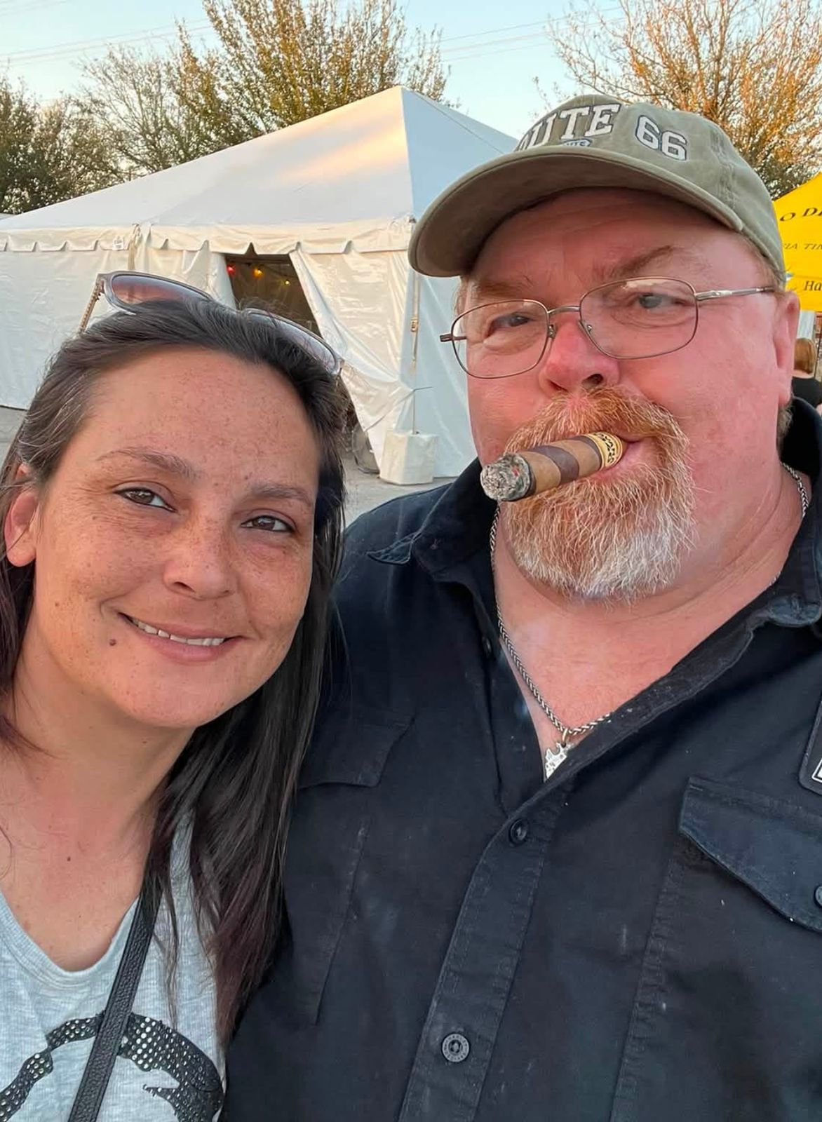 Neil outdoors with a cigar beside Jamie