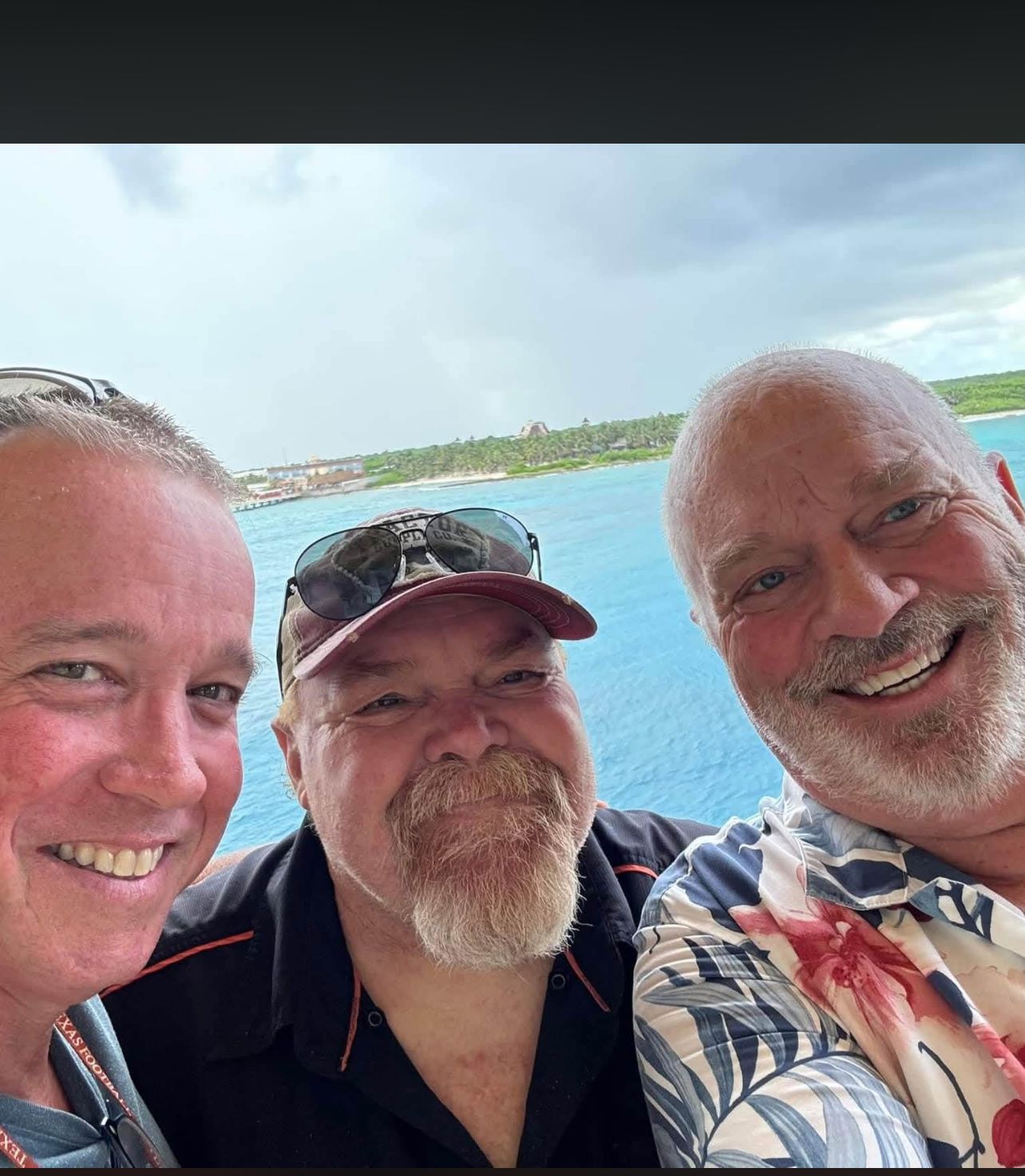 Neil with friends by the water