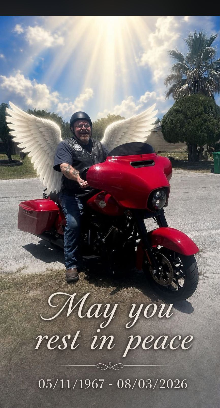 Memorial tribute of Neil on his red motorcycle with angel wings