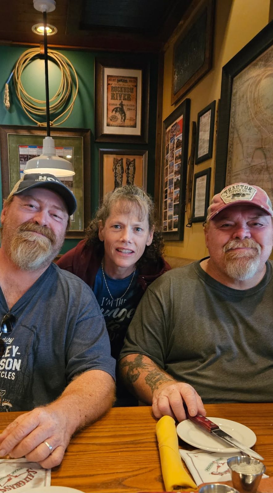 Neil at a restaurant table with family