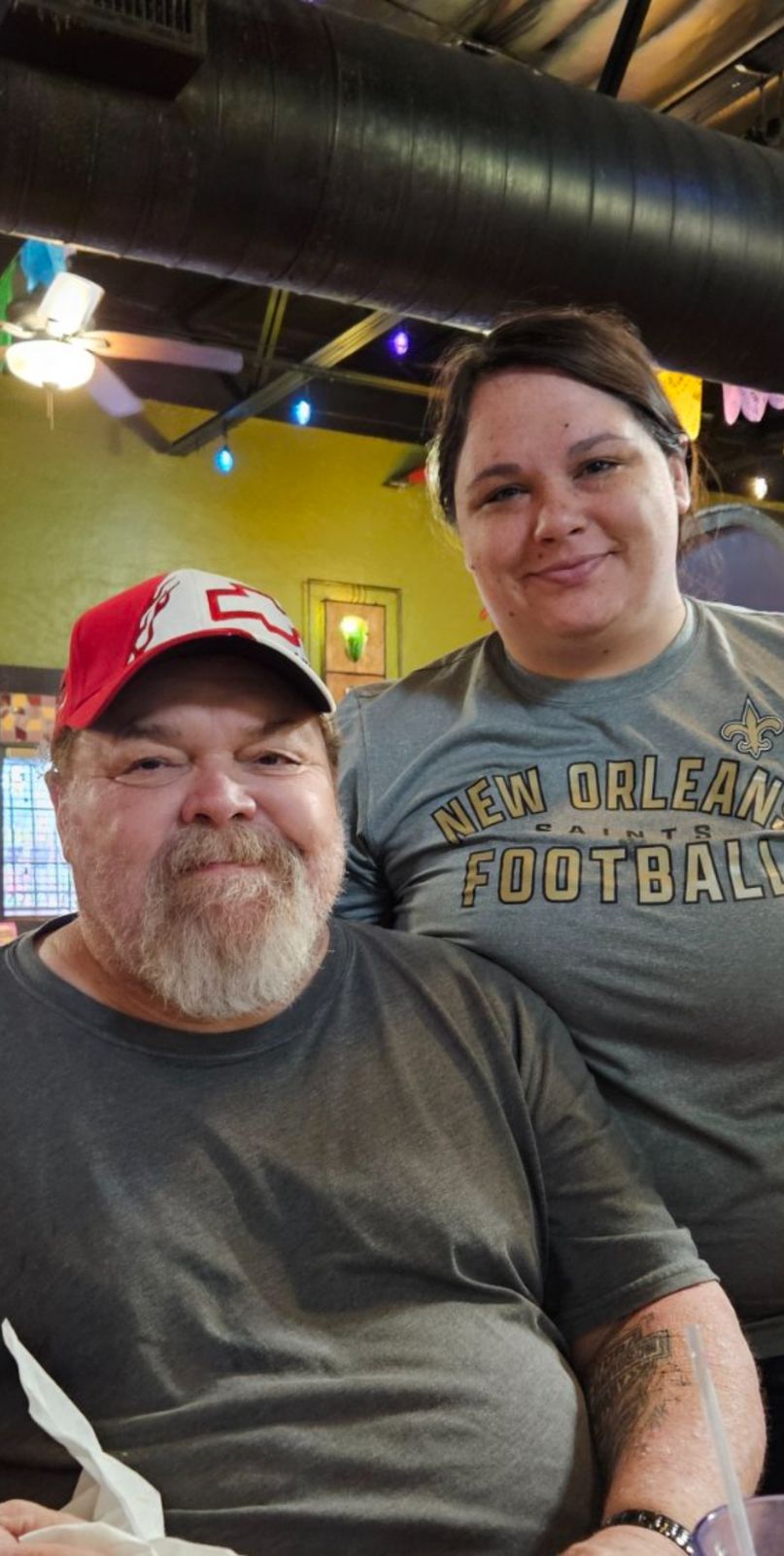 Neil at a restaurant table with a loved one